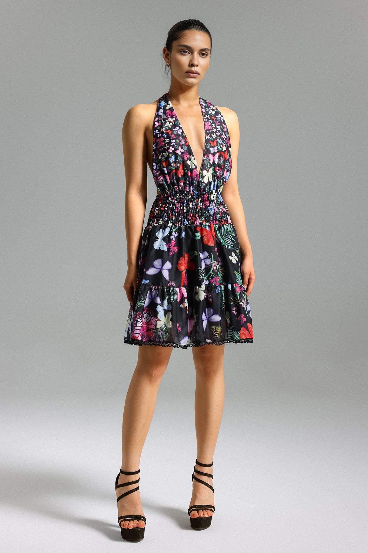 Tinsley Floral Mini Dress - Halter Neckline - Smocked Bodice - Flared Skirt - Vibrant Print