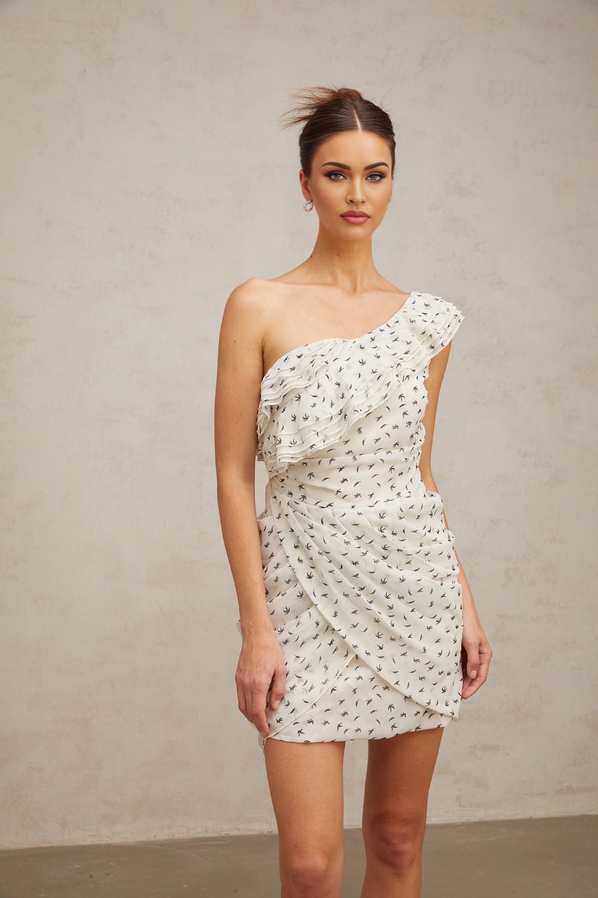 Angelina Mini Dress - One - shoulder design - Defined waistline - Stylish pattern - Delicate ruffled accents