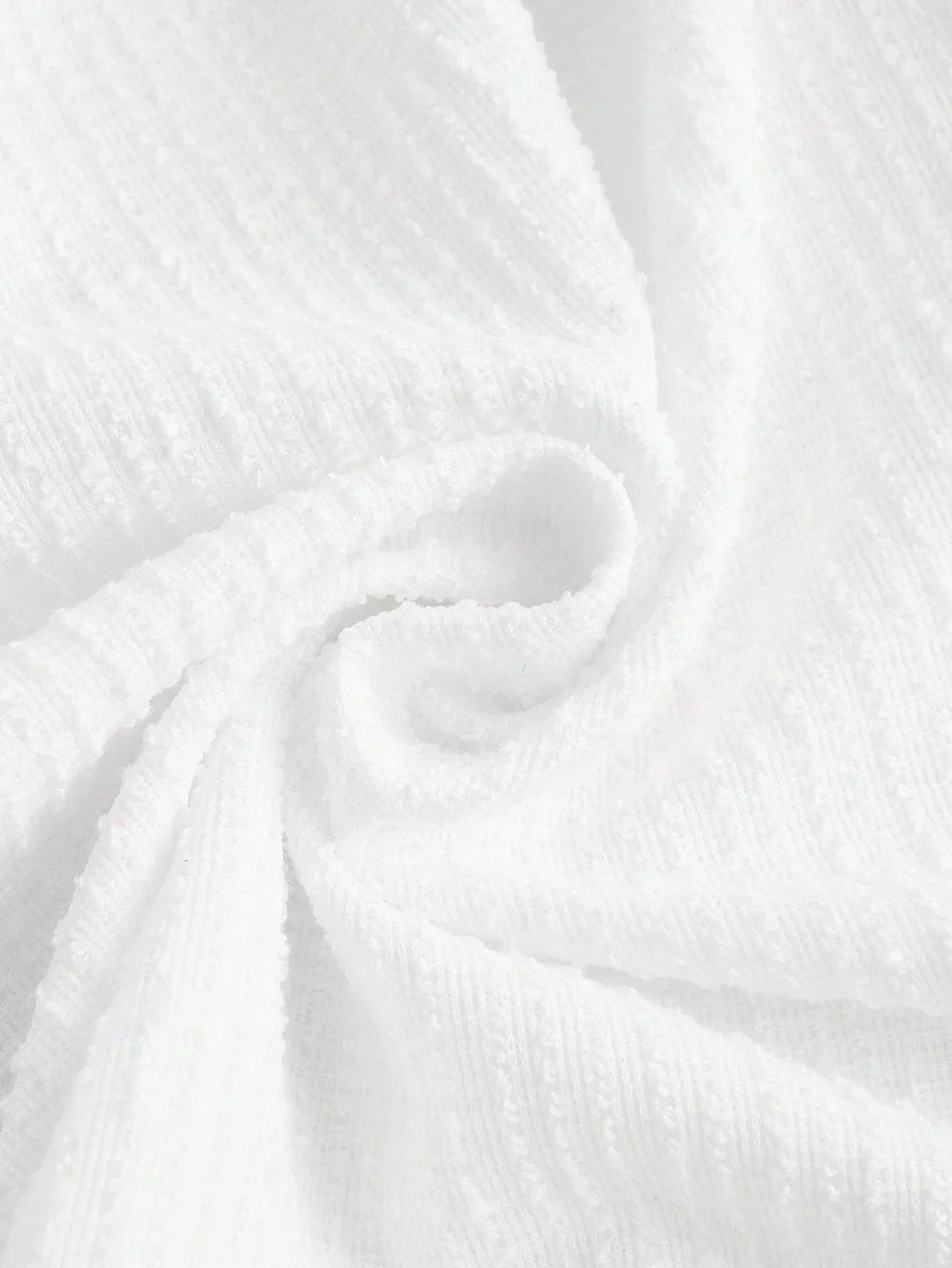 This elegant white dress features a soft, textured fabric that drapes beautifully for a flattering fit. Perfect for warm.