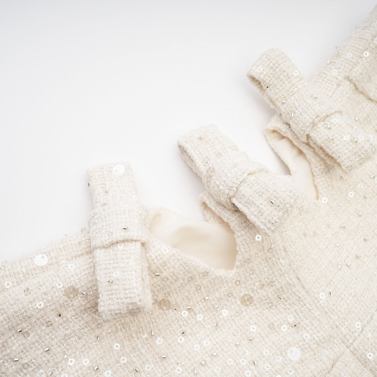 Brynn Mini Dress - Sleeveless with Sequin Detailing - Cut - Out Design - Crystal Embellishments - Bow Accent