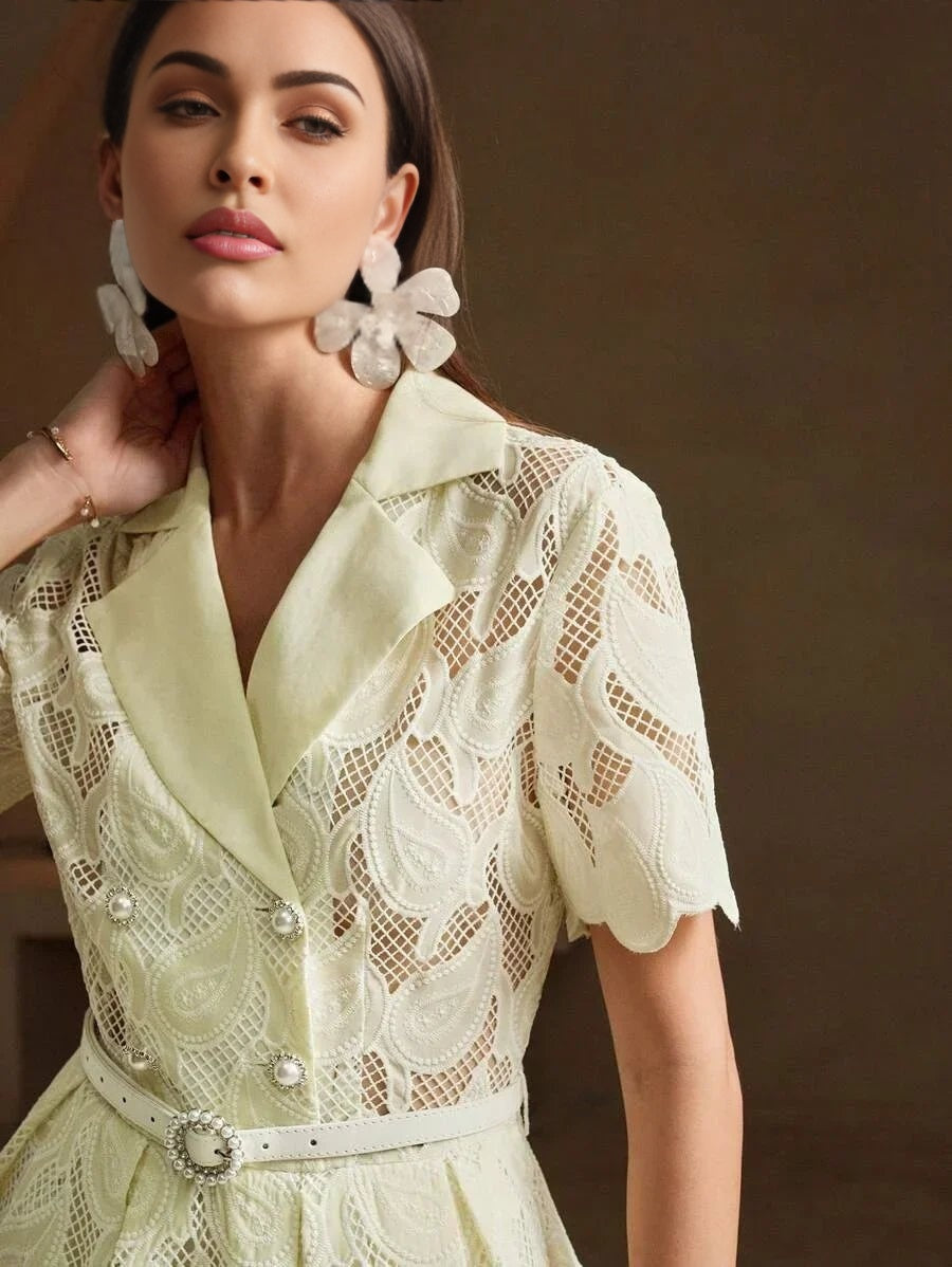 This elegant dress features a soft, pastel yellow hue with intricate lace detailing that adds a romantic touch. The fitted.