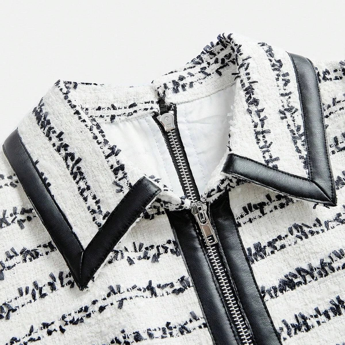This chic dress features a stylish stripped pattern in a soft cream and navy color palette, combining a textured fabric with.