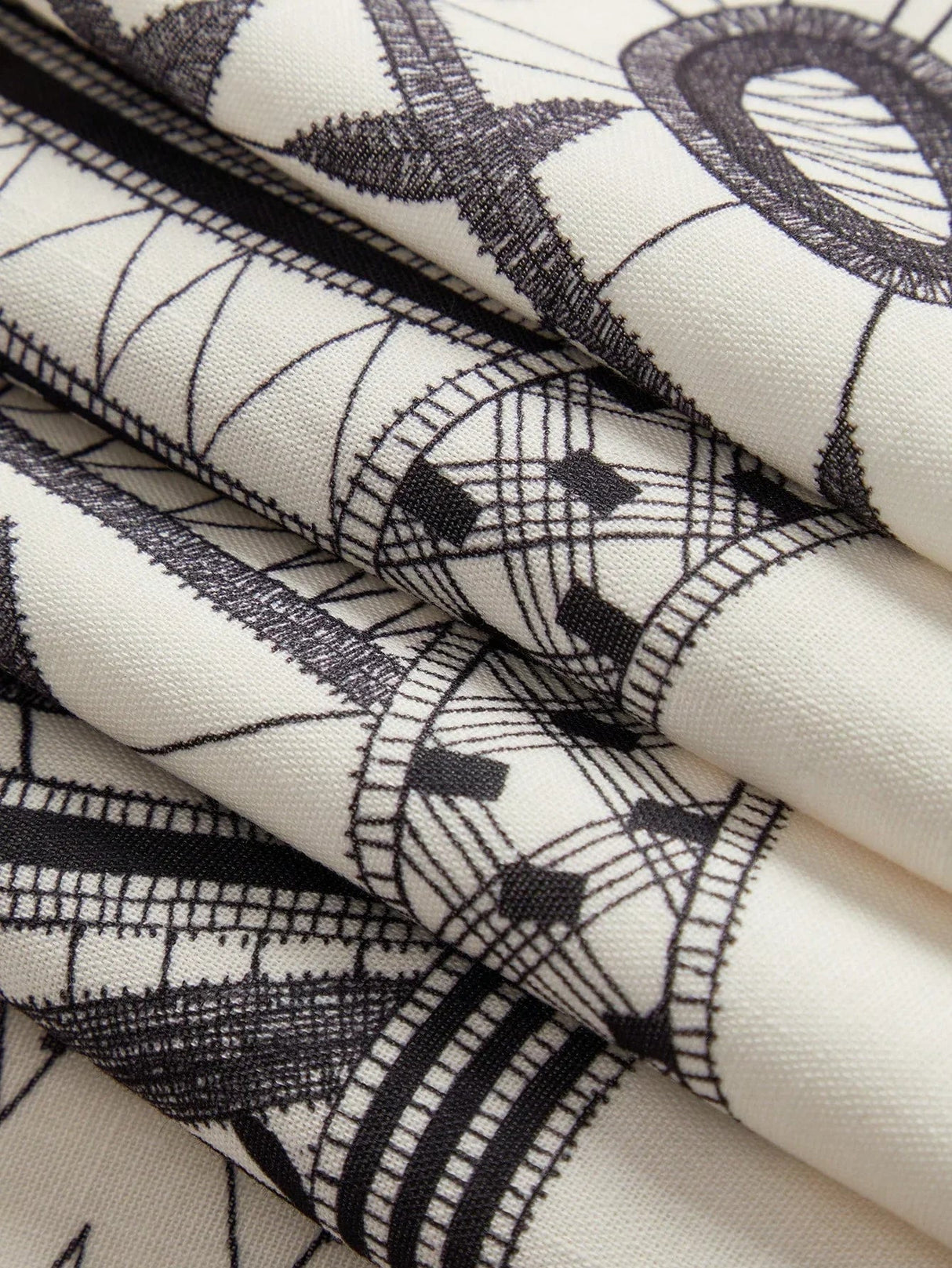 A beautifully designed dress featuring an intricate black and white patterned fabric, showcasing a stylish and modern.