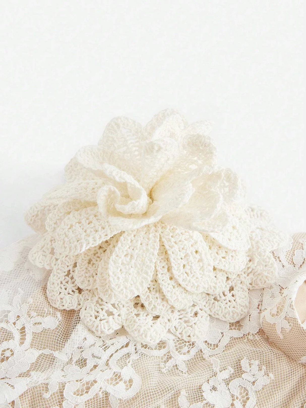 Delicate and feminine, this cream-colored lace dress features intricate floral patterns that evoke a vintage charm. The.