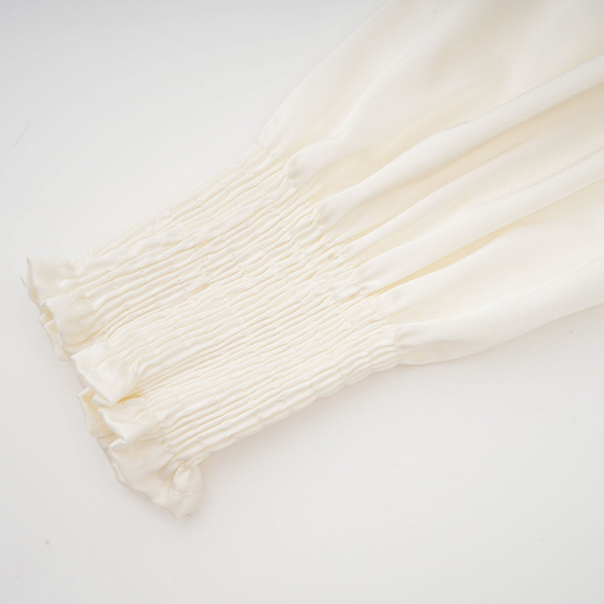 Nouria White Satin Cropped Blouse With Twist Front and Smocked Hem