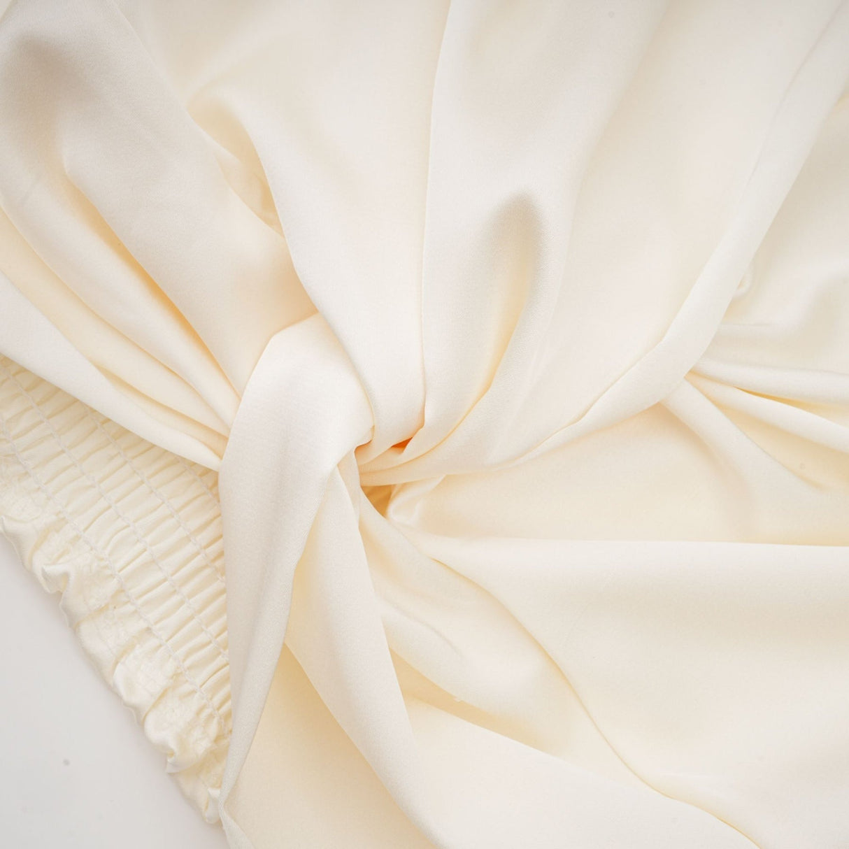 Nouria White Satin Cropped Blouse With Twist Front and Smocked Hem