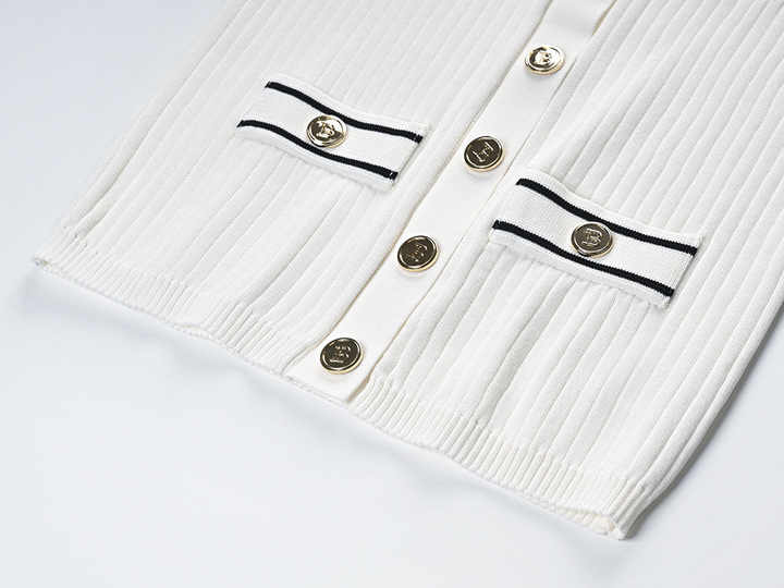 Raven Top – Fitted Ribbed Knit – Collared Design – Gold Button Accents – Decorative Pockets – Tailored Silhouette – Stretch Fabric