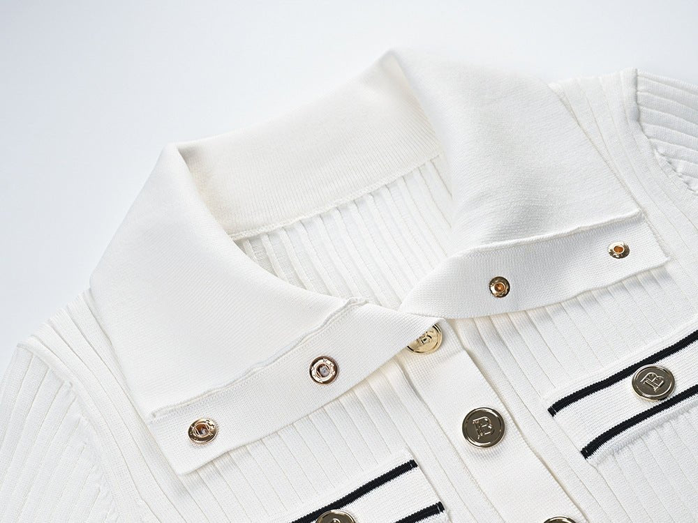 Raven Top – Fitted Ribbed Knit – Collared Design – Gold Button Accents – Decorative Pockets – Tailored Silhouette – Stretch Fabric