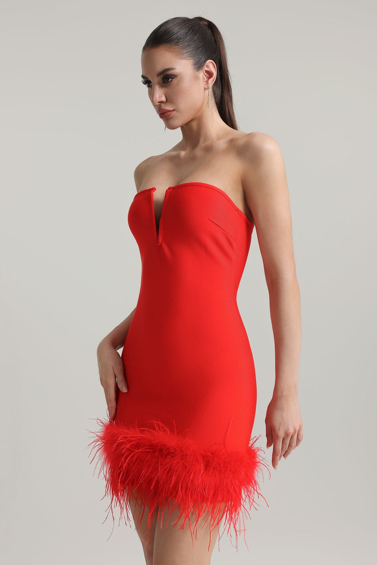 Red Moss Strapless Feather Bandage Mini Dress showcasing elegance and boldness with feather detailing