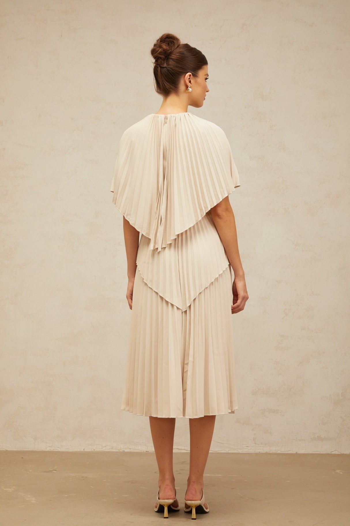 Serafina Midi Dress in Neutrals Crew Neck Batwing Pleated Cape Zip Calf Length
