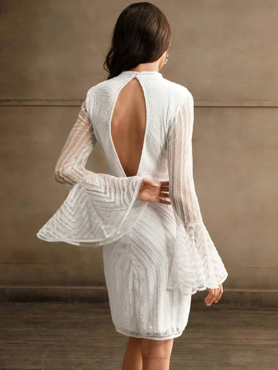 This elegant white dress features a striking open back and flowing bell sleeves, creating a chic silhouette perfect for.
