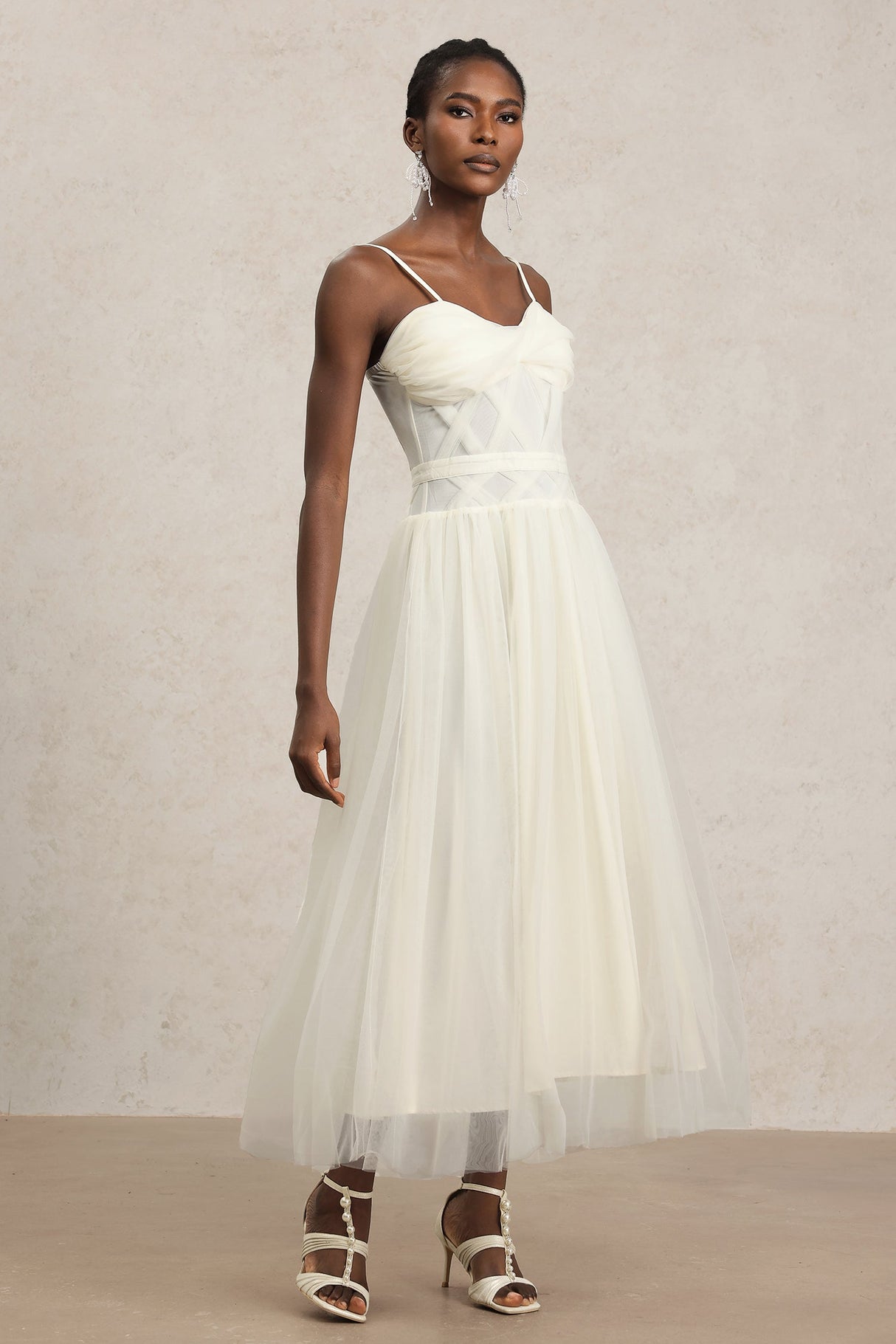 Valerie White Halterneck Formal Dress with Intricate Detailing and Flowing Skirt