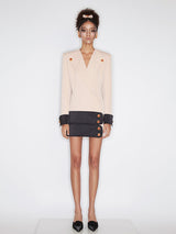 Double-breasted blazer dress with contrast details, decorative buttons, and a tailored fit. Made from 90% polyester, 10% spandex with 96% polyester, 4% spandex accents