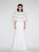 Sophia asymmetric white evening dress with a delicate bow detail, flowing silhouette, and layered hemline, crafted from lightweight polyester.