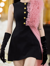 Sophia black dress with a classic A-line silhouette, gold button details, and dramatic pink tulle embellishment, crafted from polyester and nylon.