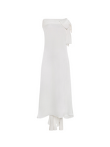 Sophia asymmetric white evening dress with a delicate bow detail, flowing silhouette, and layered hemline, crafted from lightweight polyester.