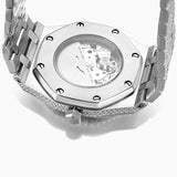 Silver watch with diamond-studded bezel on a white background