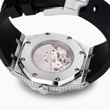 Close-up of a watch with a black strap and silver case on a white background