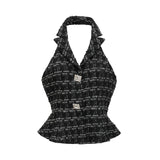 A black and white checked tweed matching set consisting of a vest top and skirt in a classic pattern