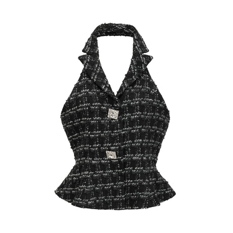 A black and white checked tweed matching set consisting of a vest top and skirt in a classic pattern