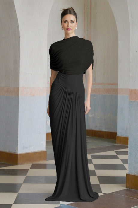 A black asymmetric maxi dress with pleated details named Catherine featuring a long flowing skirt and uneven hemline