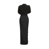 A black asymmetric maxi dress with pleated details worn by a model standing against a plain background