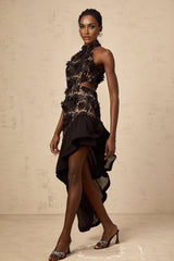 A black asymmetric midi dress with floral applique details featuring the Bernadette design
