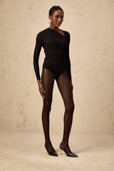 A black bodysuit with an asymmetric design featuring a split detail modeled on a person against a plain background