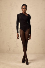 A black bodysuit with an asymmetric design featuring a split front and a sleek silhouette worn by a model against a plain background