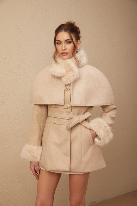 A black faux fur coat with a detachable cape collar featuring the Rosella design