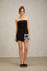 A black fitted mini dress with studded details and a bowknot accent