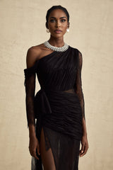 A black floorlength maxi dress with a single shoulder strap and a cut out detail on one side