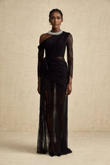 A black floorlength maxi dress with a single shoulder strap and a cutout detail on one side