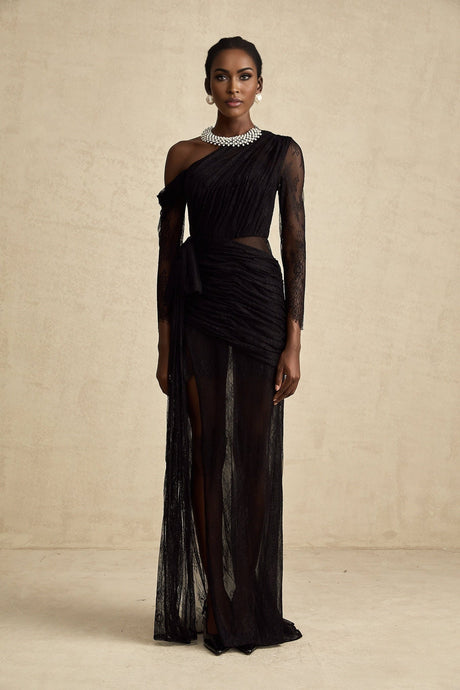 A black floorlength maxi dress with a single shoulder strap and a cutout detail on one side