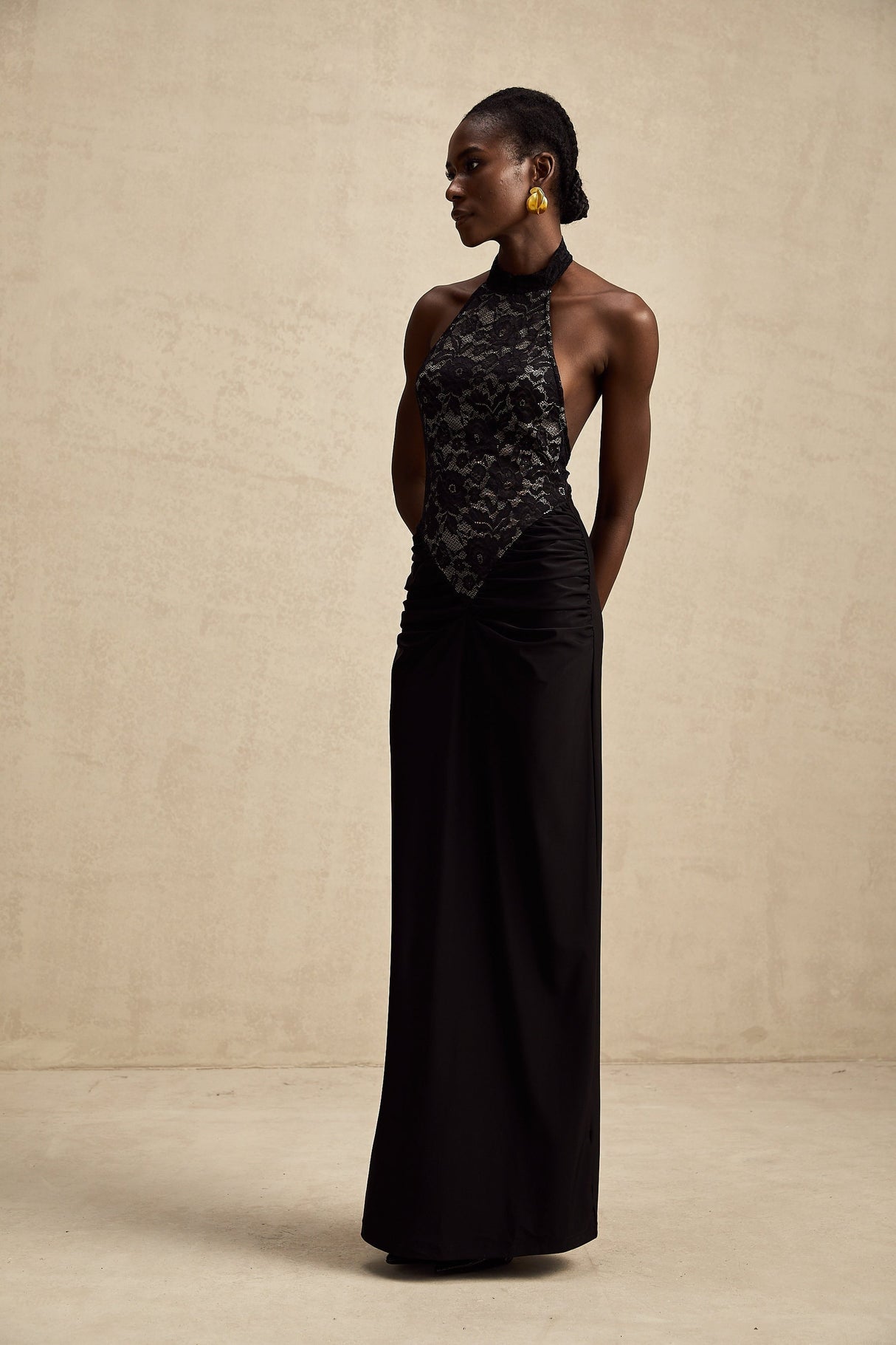 A black floral lace maxi dress with halter neck style featuring Camille design