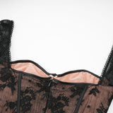 A black fulllength maxi dress with flared silhouette and lace details named Marlene