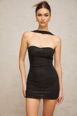 A black halterneck mini dress adorned with rhinestones featuring a sleek design and sparkling embellishments