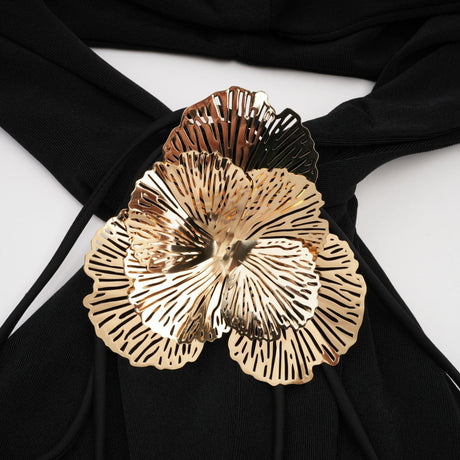 A black hooded maxi dress with floral applique details called Axelle