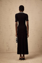 A black knitted midi dress with studded embellishments named Laetitia featuring a fitted silhouette and long sleeves