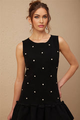 A black knitted mini dress with bead embellishments called Blanche