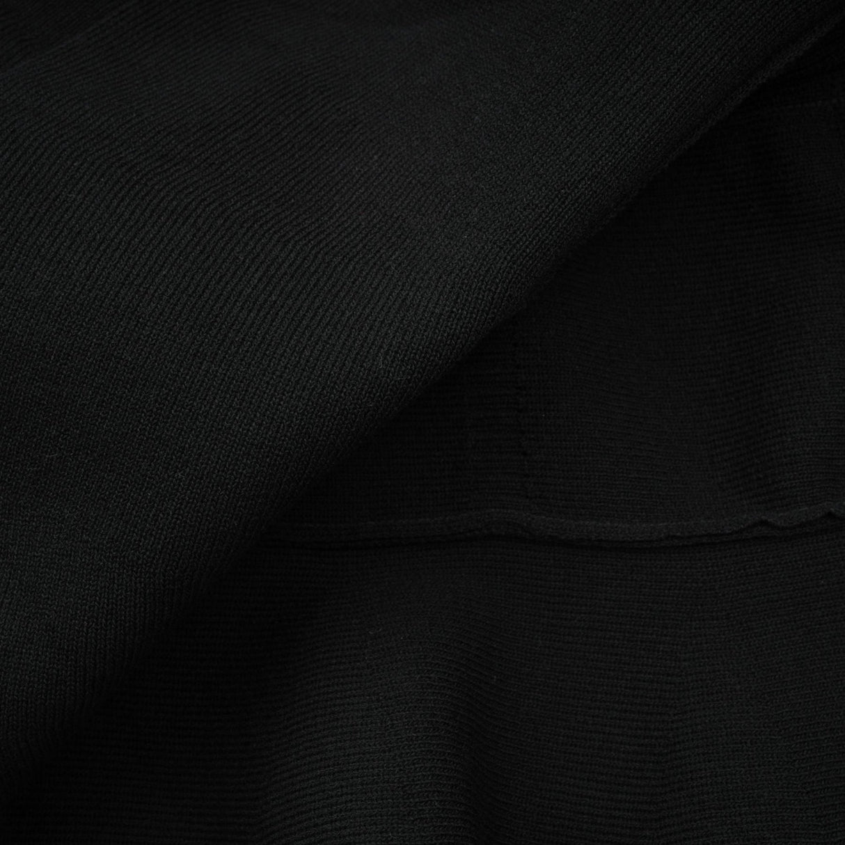 A black knitted mini dress with embellishments and ruffled details named Fabienne