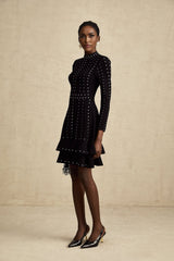 A black knitted mini dress with embellishments and ruffled details named Fabienne