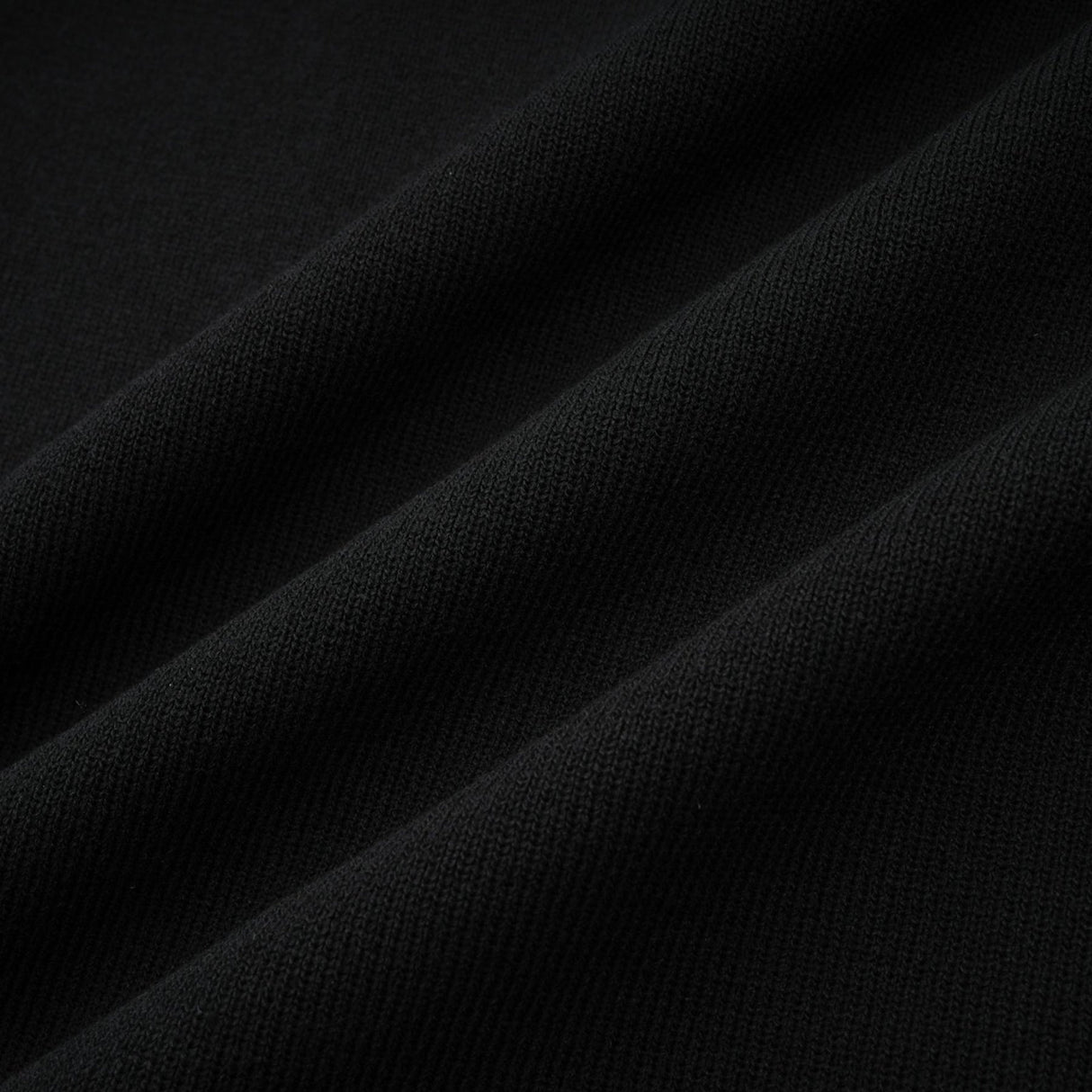 A black knitted mini dress with embellishments and ruffled details named Fabienne