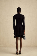 A black knitted mini dress with embellishments and ruffles named Fabienne