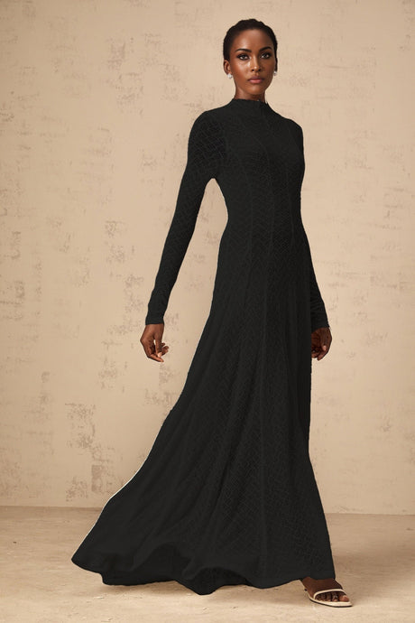 A black lace maxi dress with a wavy pattern design called Athena featuring a full length skirt and delicate lace details throughout