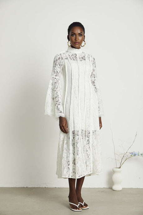 A black lace midi dress with cutout details by Celine
