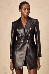A black leather blazer mini dress featuring a tailored fit collar lapels and long sleeves styled as a short dress with a feminine silhouette