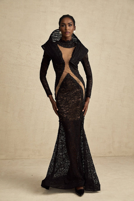 A black long formal dress with a structured bodice and fishtail skirt featuring a thigh high split
