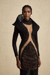 A black long formal dress with a structured bodice and fishtail skirt featuring a thigh high split