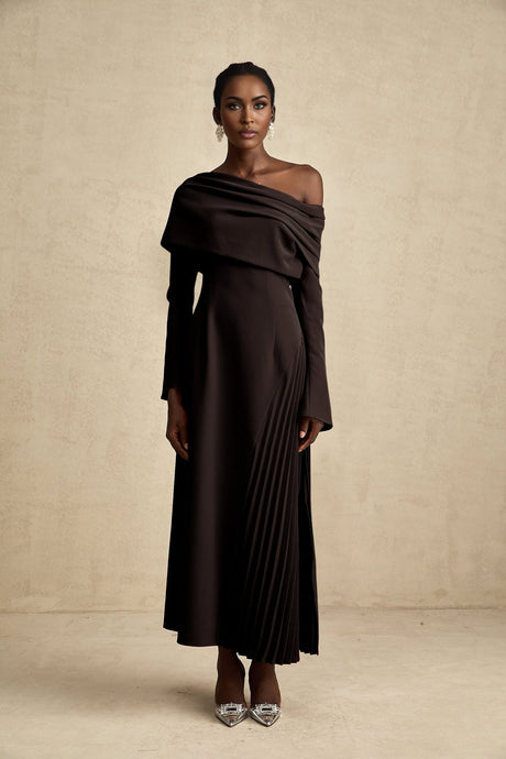 A black long maxi dress with a high slit and pleated design suitable for Valentines Day occasion